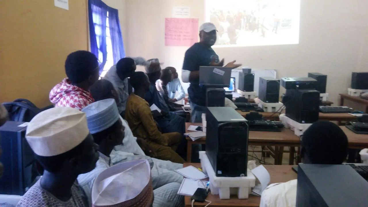 Kingsley Udo training community volunteers on psychosocial support for children in emergencies