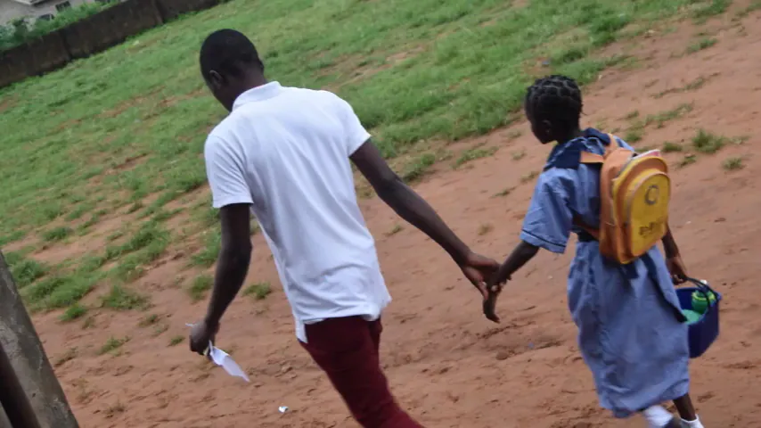 Two children walking to school in the Back2School film