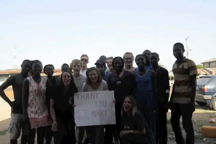 Volunteers gathered in a Nigerian community